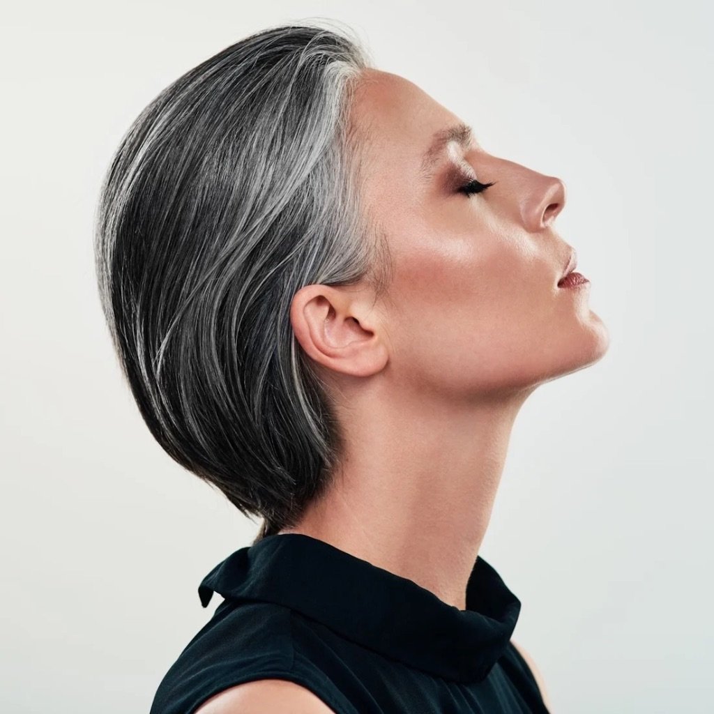 Elegant mature woman showcasing tight skin and defined jawline axis suited for Ultraformer III HIFU treatment.